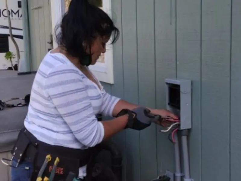 Licensed electrician wiring an exterior subpanel in College Place
