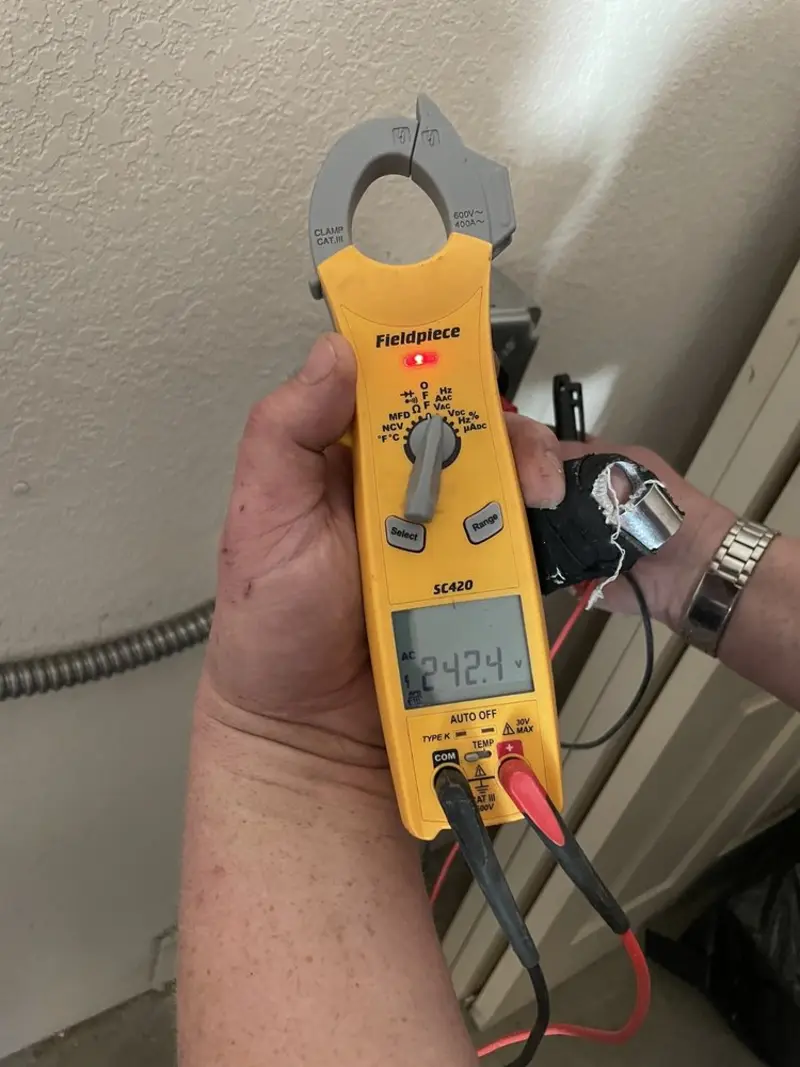 Voltage testing with clamp meter during Recessed Lighting Installation in College Place
